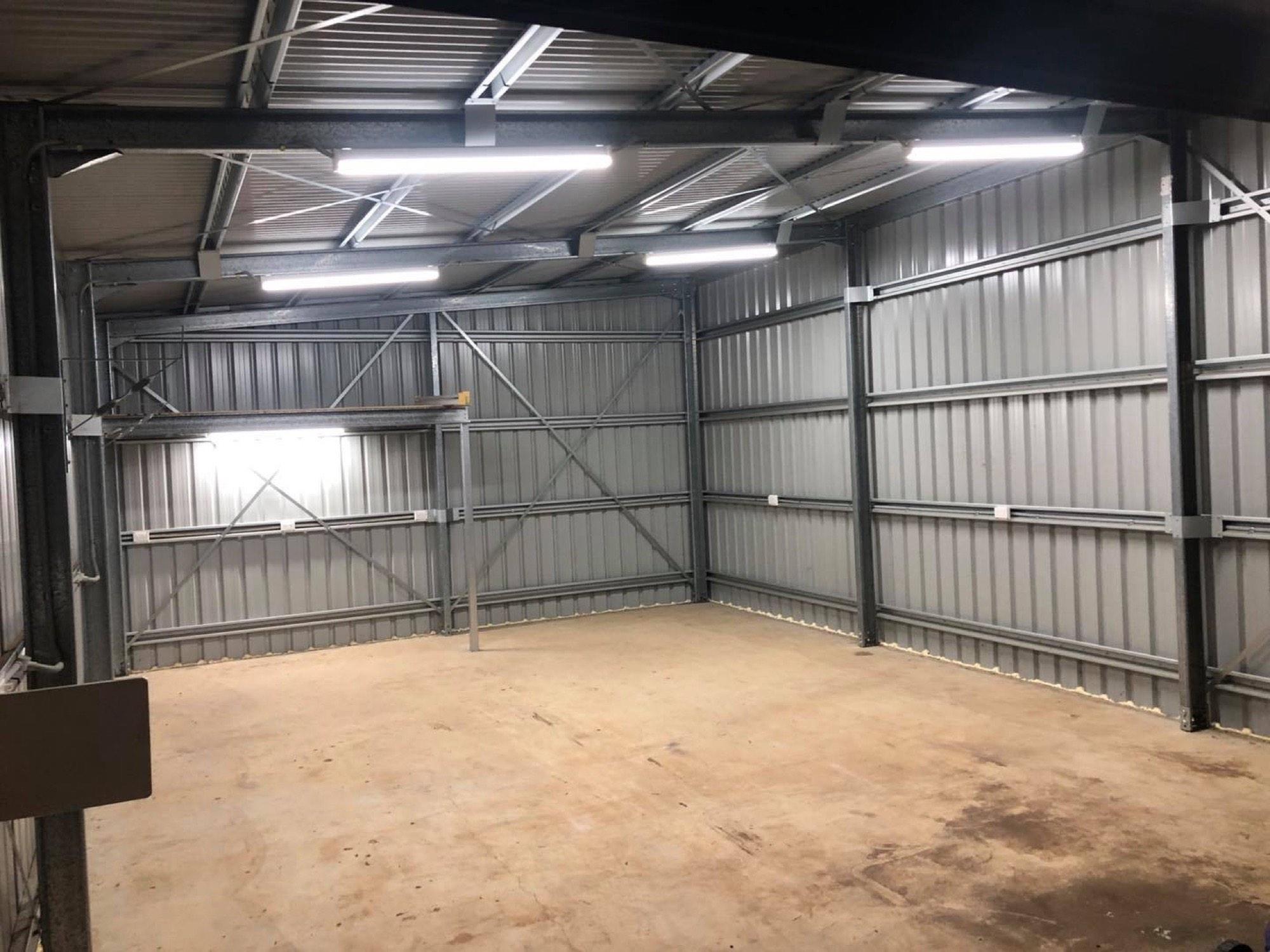 The inside of a newly built shed with lighting installed