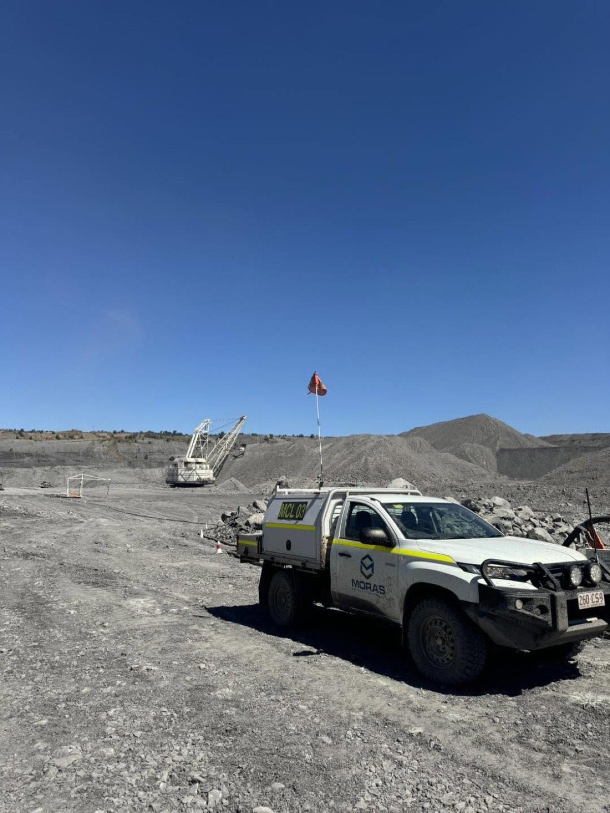 An MCG Projects service ute parked on a haul road at a Central Queensland mine site