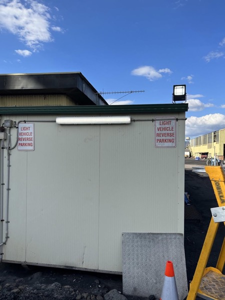 A cool room set up on a hardstand at an industrial site